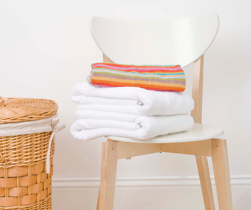 Adding extra towels, pillows, and blankets is a thoughtful guest room addition.